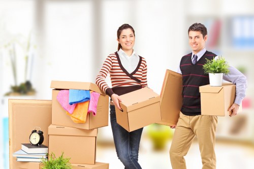 Packed moving boxes and furniture ready for house removals