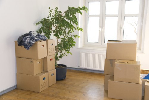 Staff using moving equipment to handle furniture safely