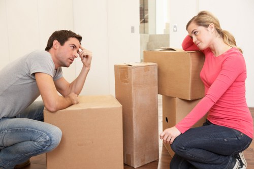 Removal staff wearing PPE during a safe house move
