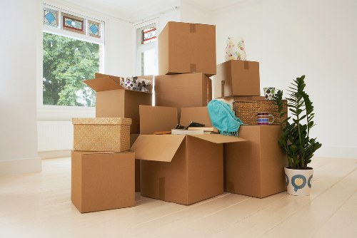 Business relocation process with labelled boxes and office furniture in Crystal Palace